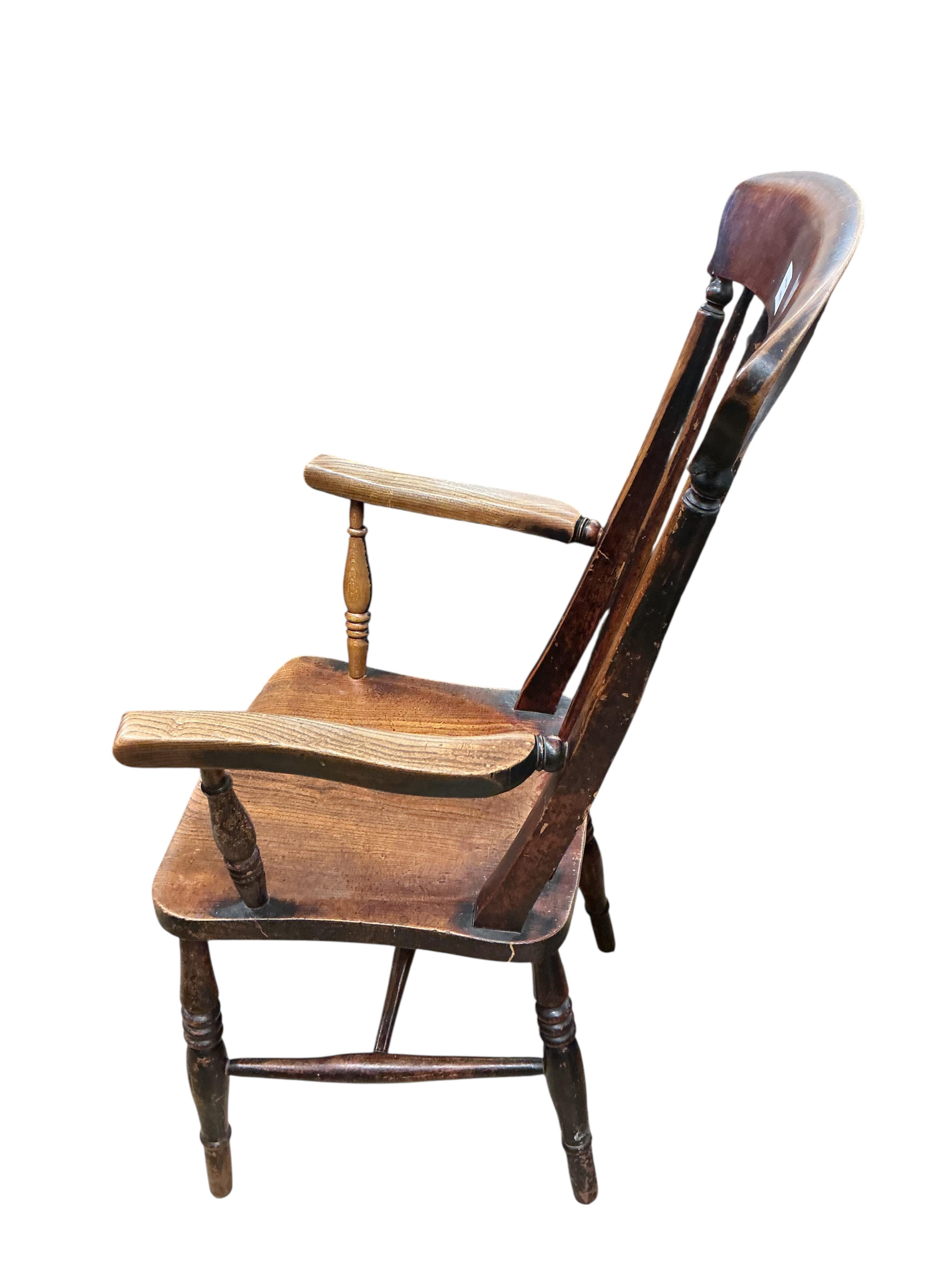 A Victorian elm, ash and beech comb back armchair, width 56cm, depth 45cm, height 107cm